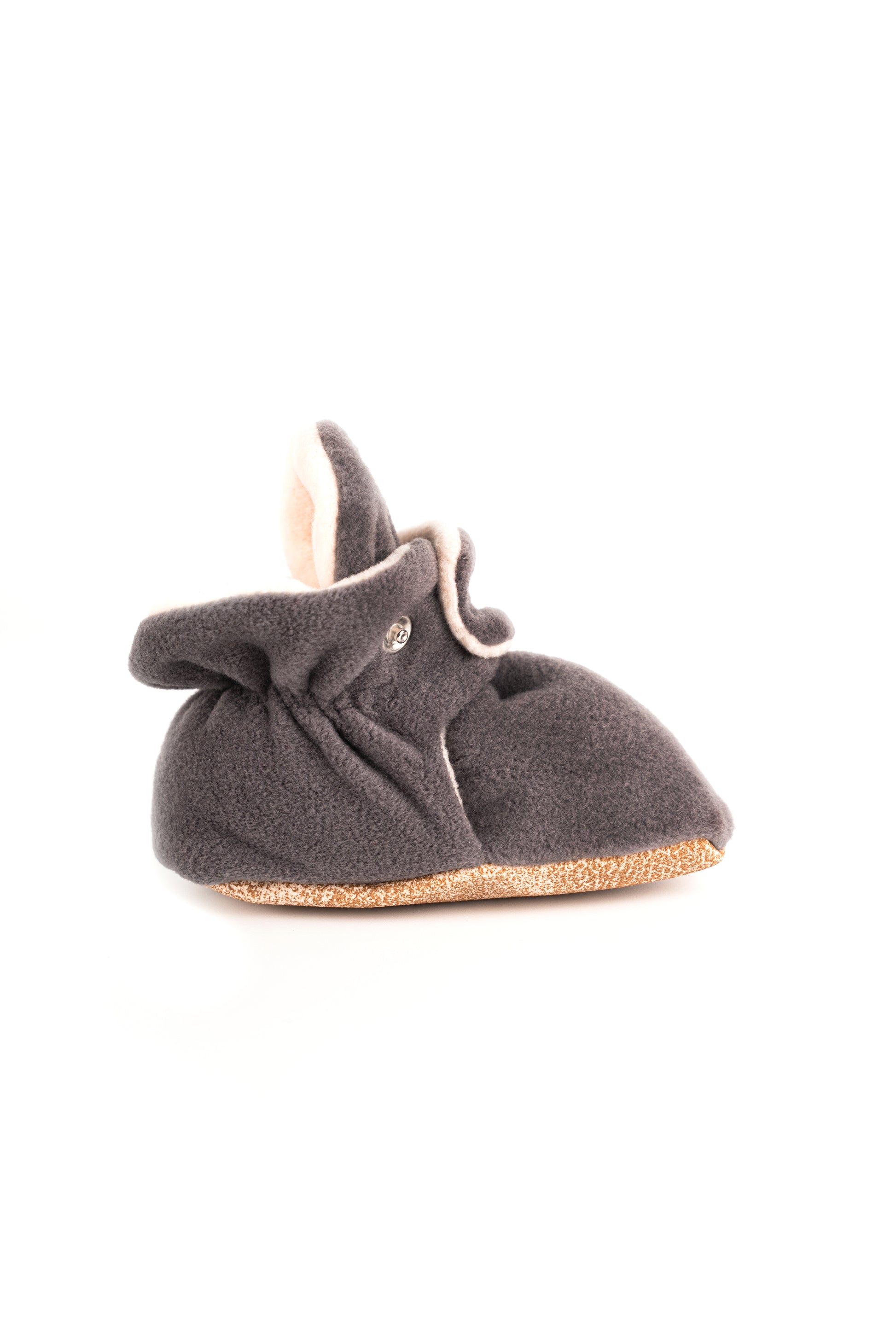 Comfortable and breathable baby booties in gray with non-slip soles for safe adventures. Left view.